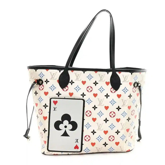 White monogram tote bag with black handles and multicolor hearts-and-cards front patch