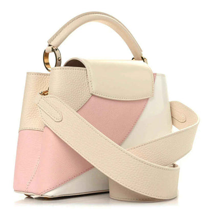 Cream and blush pink leather handbag with wide shoulder strap and front flap