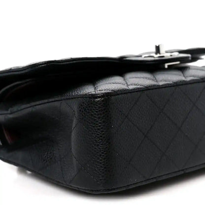 Black caviar-quilted leather flap bag with top turn-lock hardware