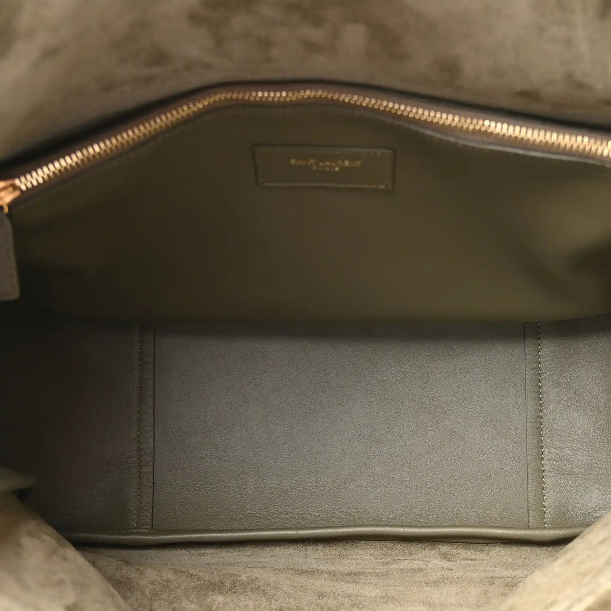 Olive hobo bag interior with fabric lining and gold-tone zipper