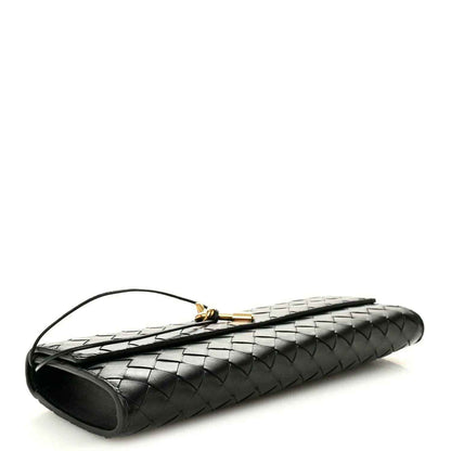 Black leather clutch with gold-tone clasp and top handle