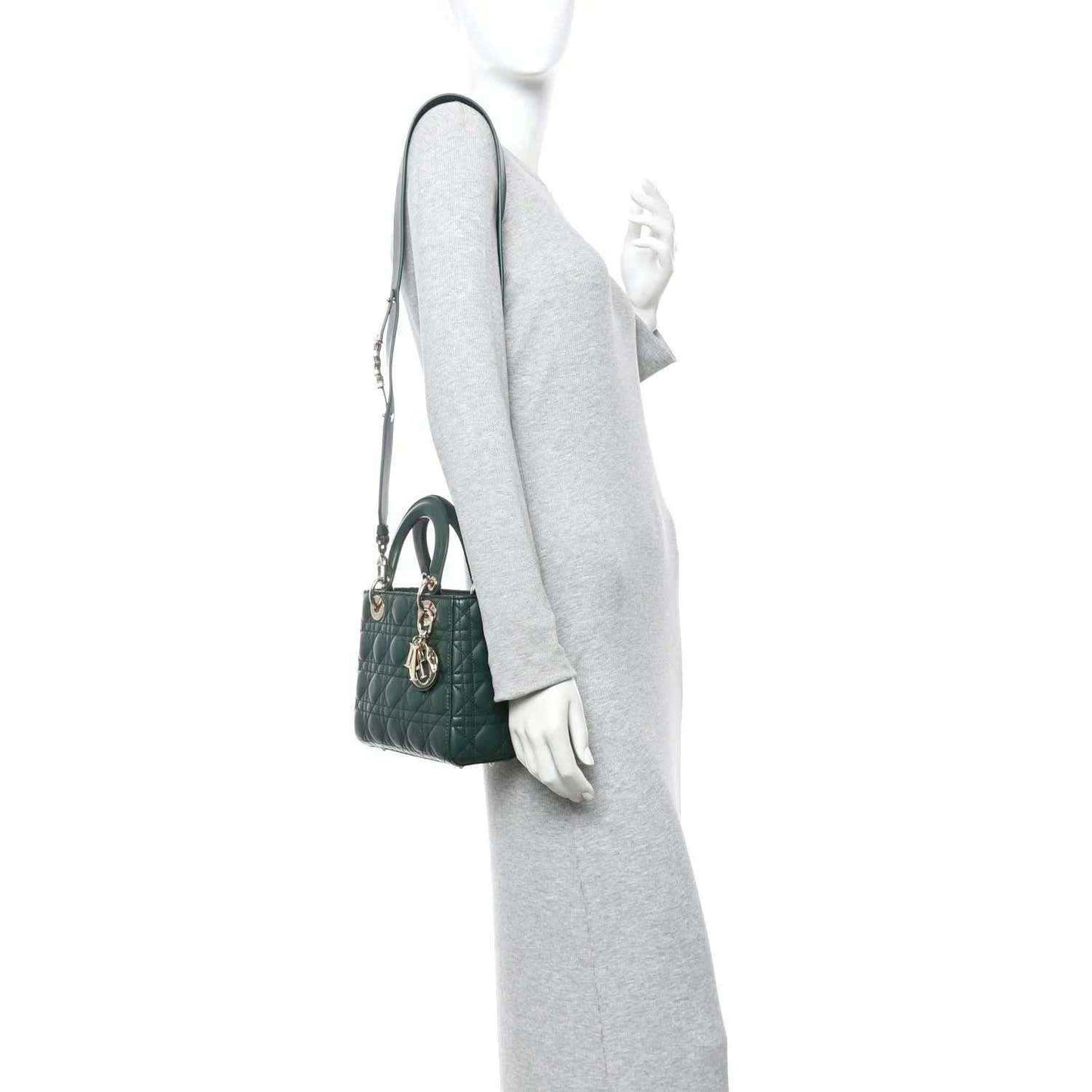 Green quilted lambskin Lady Dior bag with shoulder strap, worn on wrist