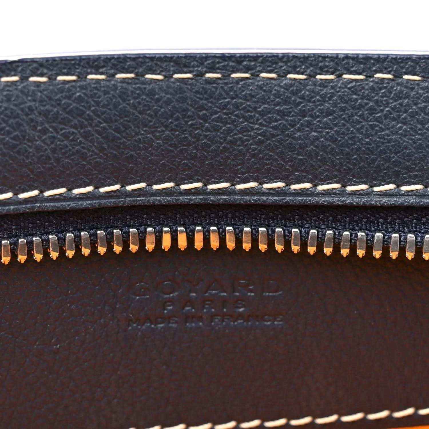 Dark navy leather edge with zipper teeth and contrast white topstitching