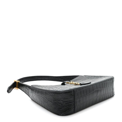 Black embossed calfskin hobo bag with flat top handle and decorative clasp detail