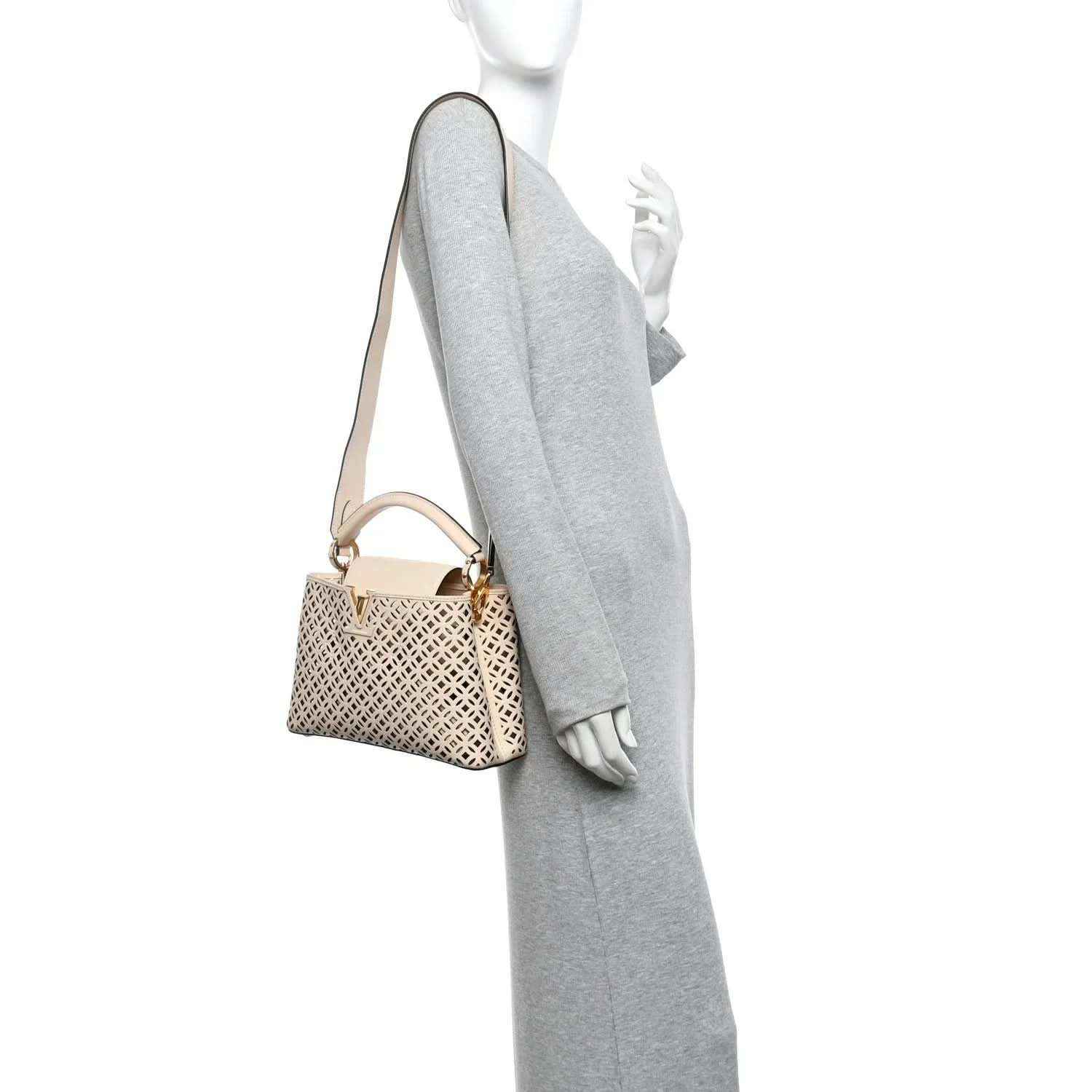 Louis Vuitton mini handbag on crossbody strap with cut-out lattice pattern