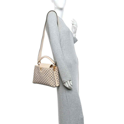 Louis Vuitton mini handbag on crossbody strap with cut-out lattice pattern