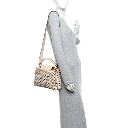 Louis Vuitton mini handbag on crossbody strap with cut-out lattice pattern