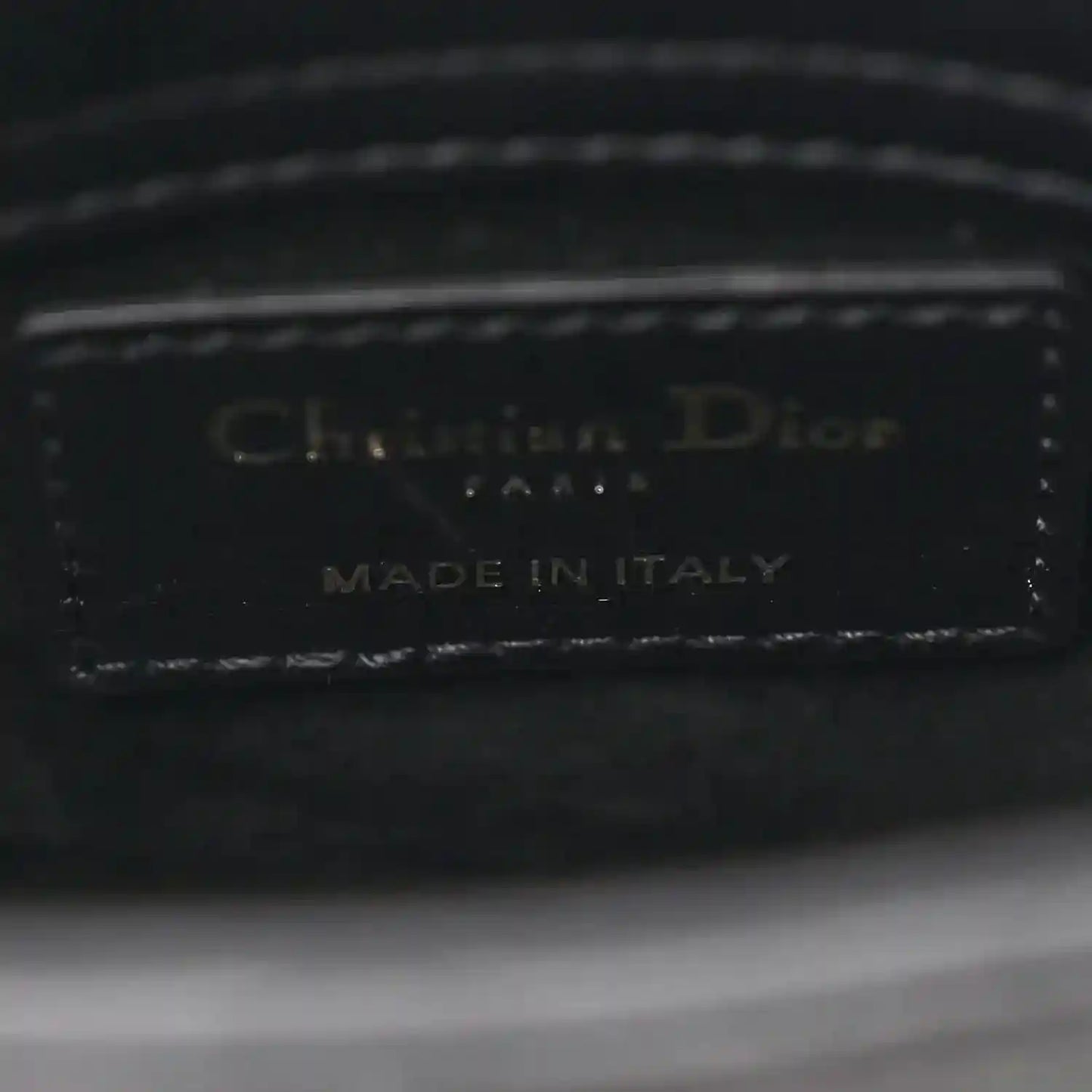 Black leather handbag interior label: Christian Dior, Made in Italy