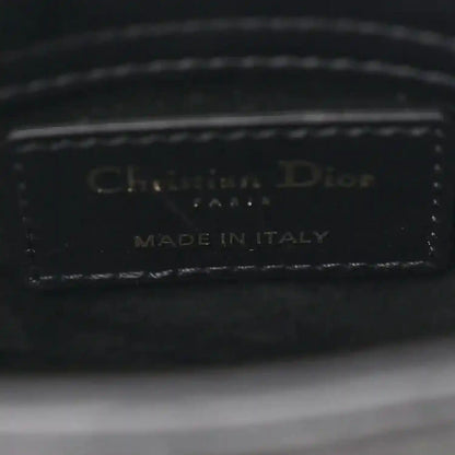Black leather handbag interior label: Christian Dior, Made in Italy