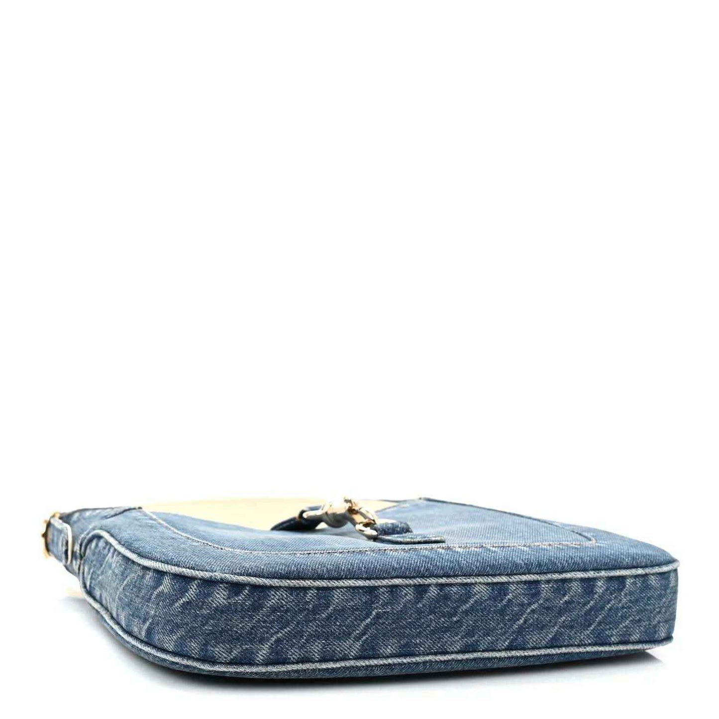 Blue denim Jackie shoulder bag with flat base and gold-tone hardware on top