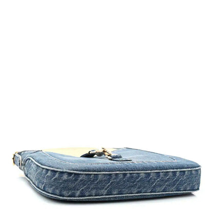 Blue denim Jackie shoulder bag with flat base and gold-tone hardware on top