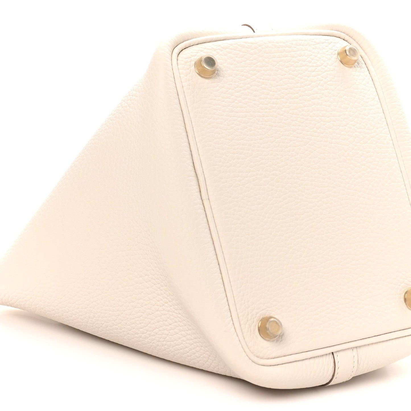 Pale cream textured leather tote bottom with corner rivets and stitched borders