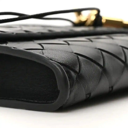 Black woven leather clutch side with top handle strap base