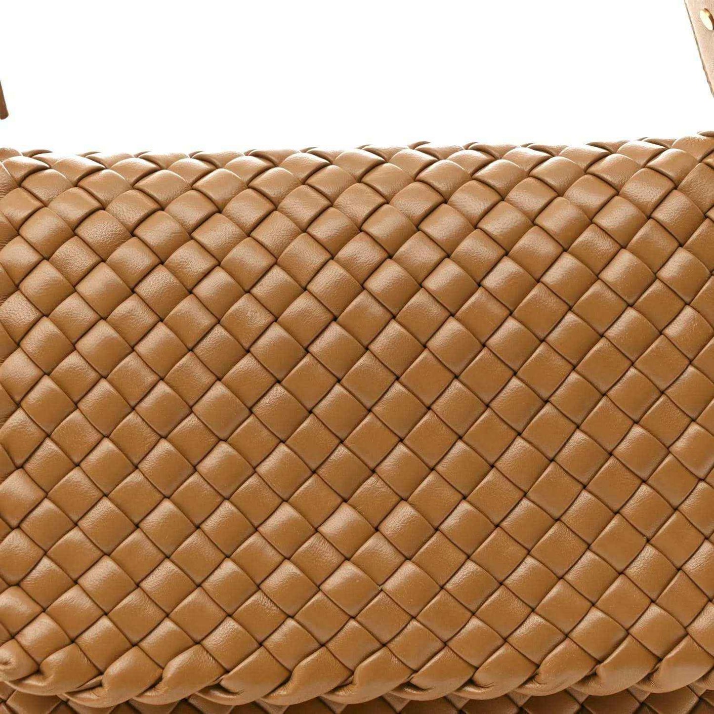 Caramel woven leather bag close-up showing cobble intreccio pattern and raised texture
