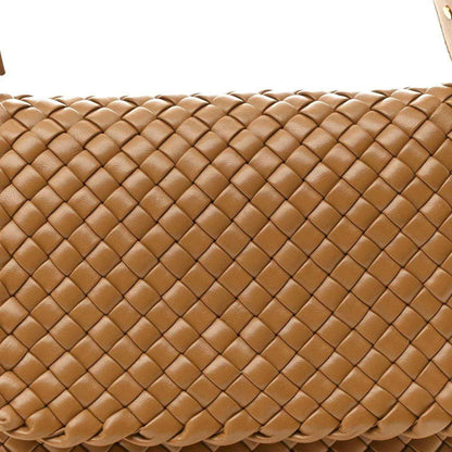 Caramel woven leather bag close-up showing cobble intreccio pattern and raised texture