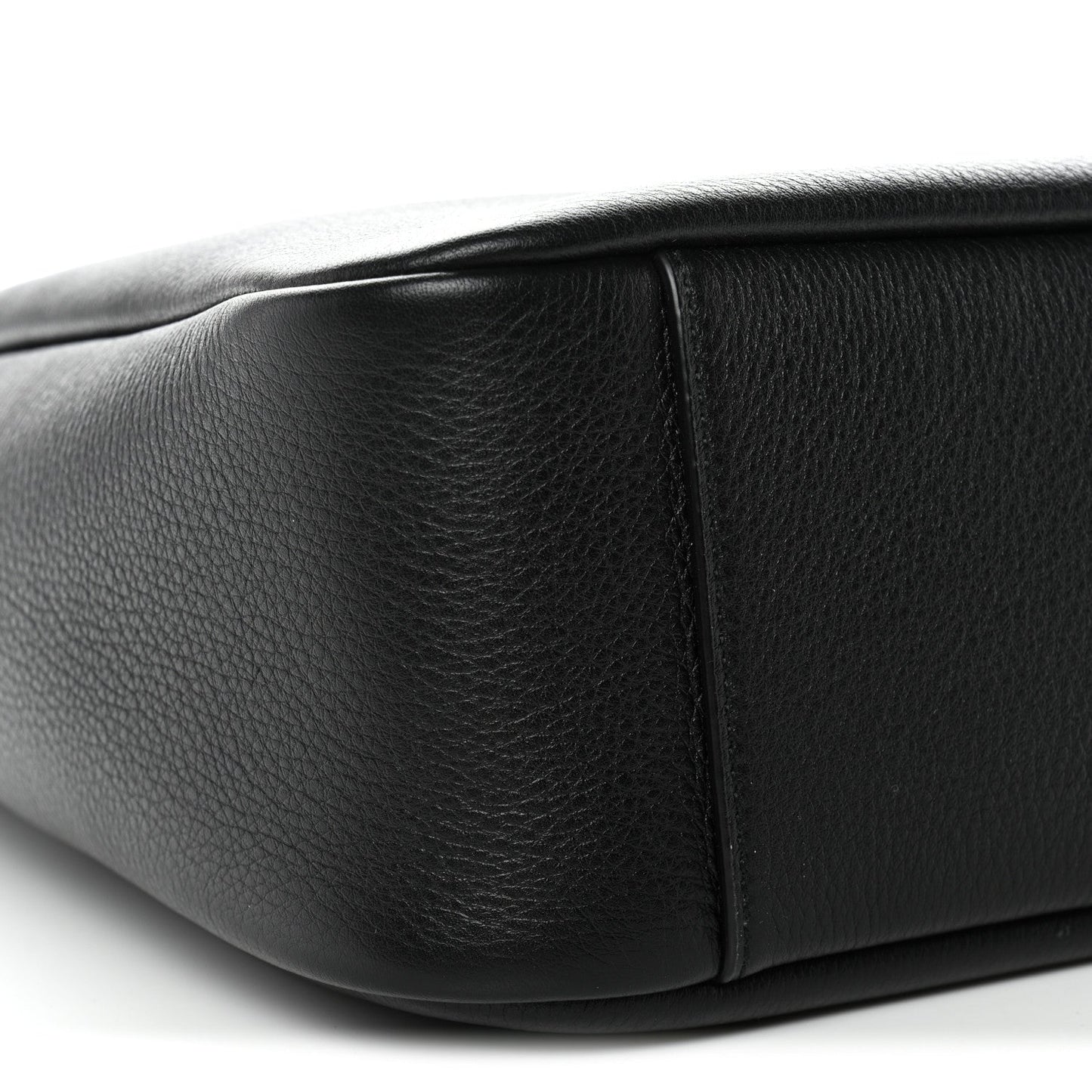 Black calfskin hobo bag side panel with structured seam and rounded bottom edge.