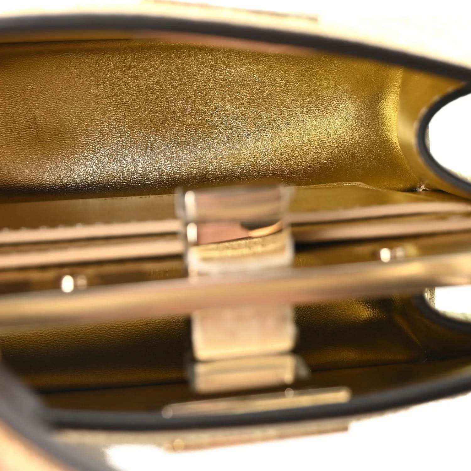 Petite Peekaboo satchel interior, gold-toned hardware and clasp at the top edge