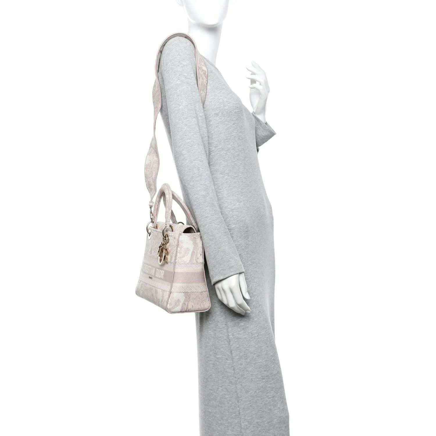 Medium rose-pink embroidered handbag with top handles, gold hardware, and charm detail