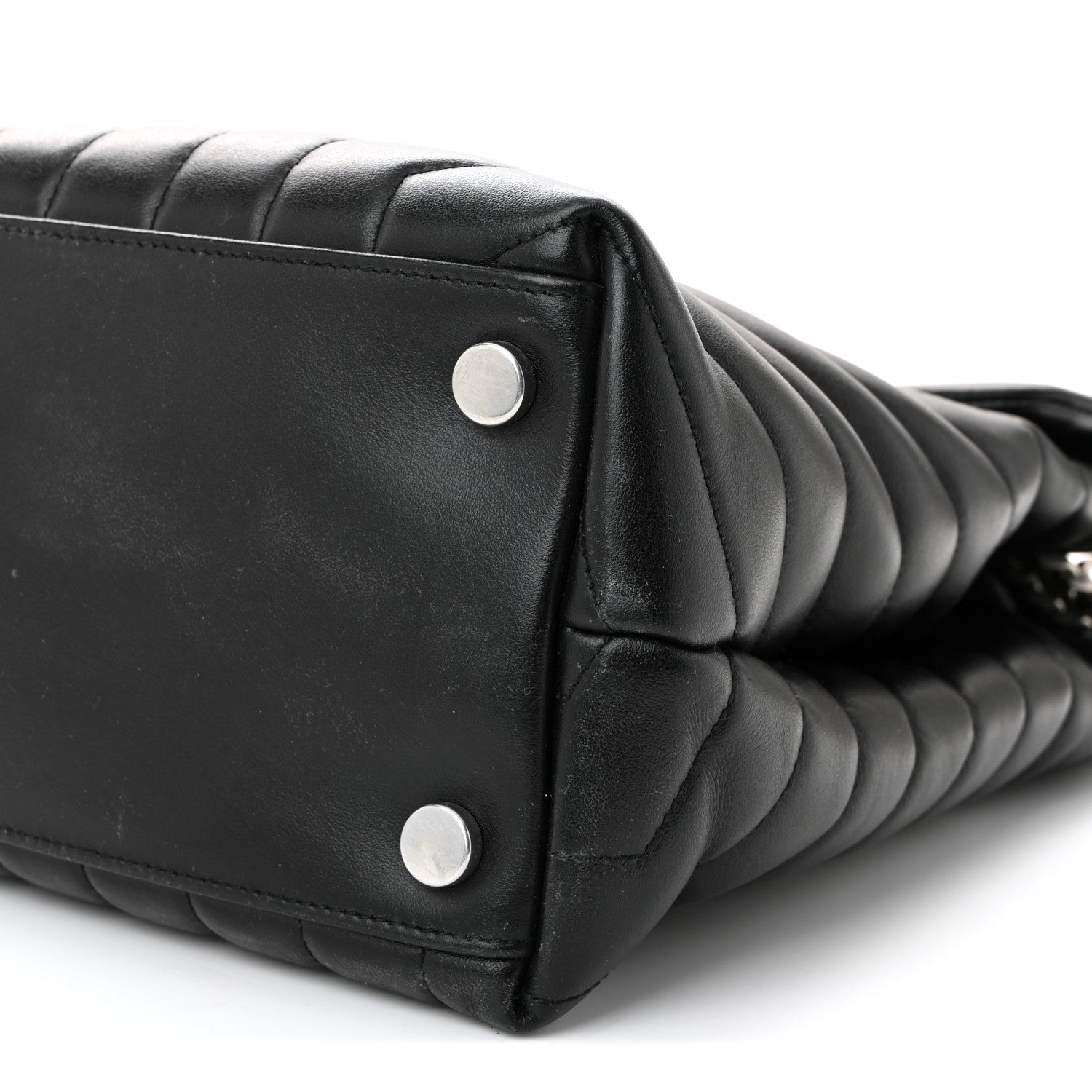 Black quilted leather satchel end with two silver rivets and chain