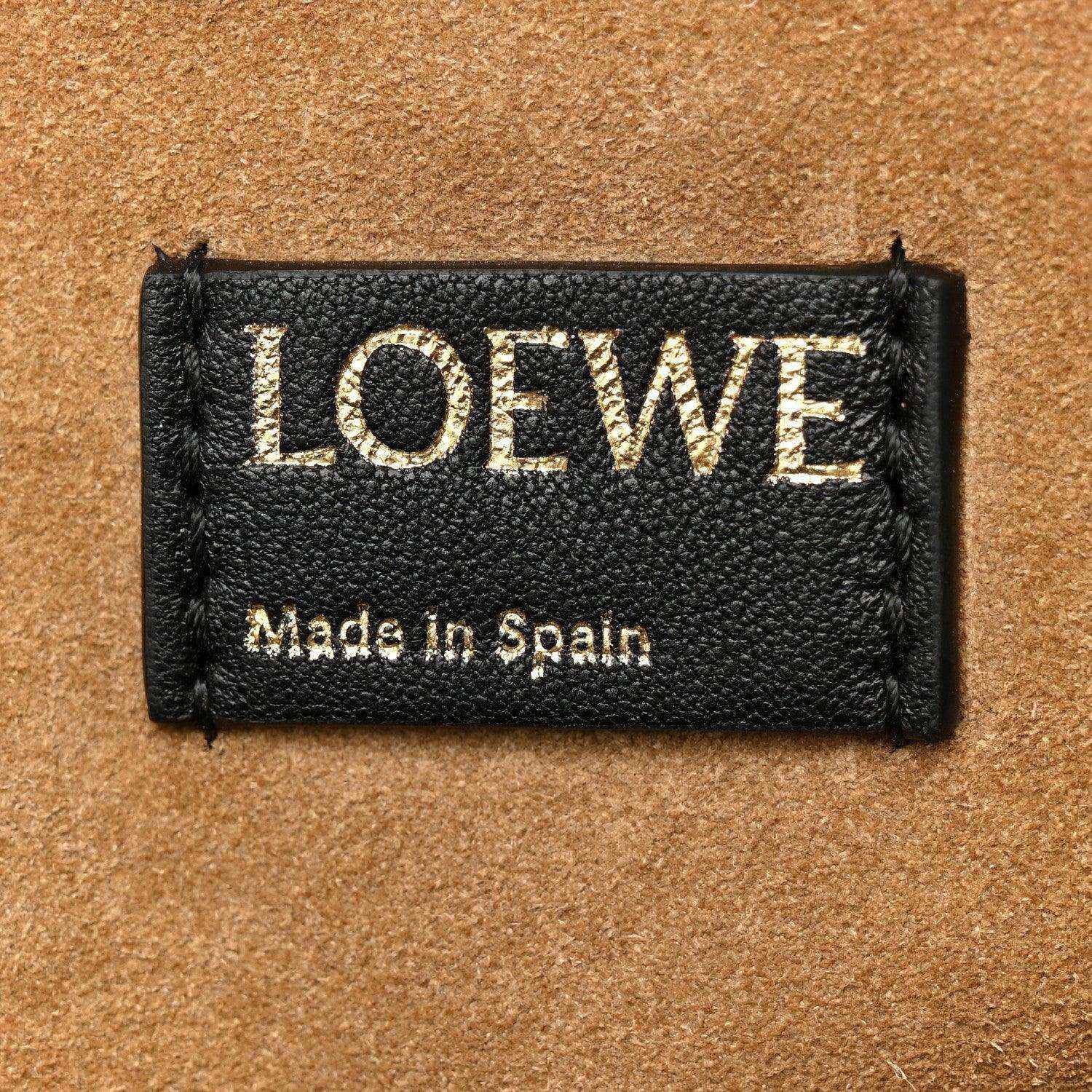 Black leather Loewe tag with LOEWE lettering and Made in Spain