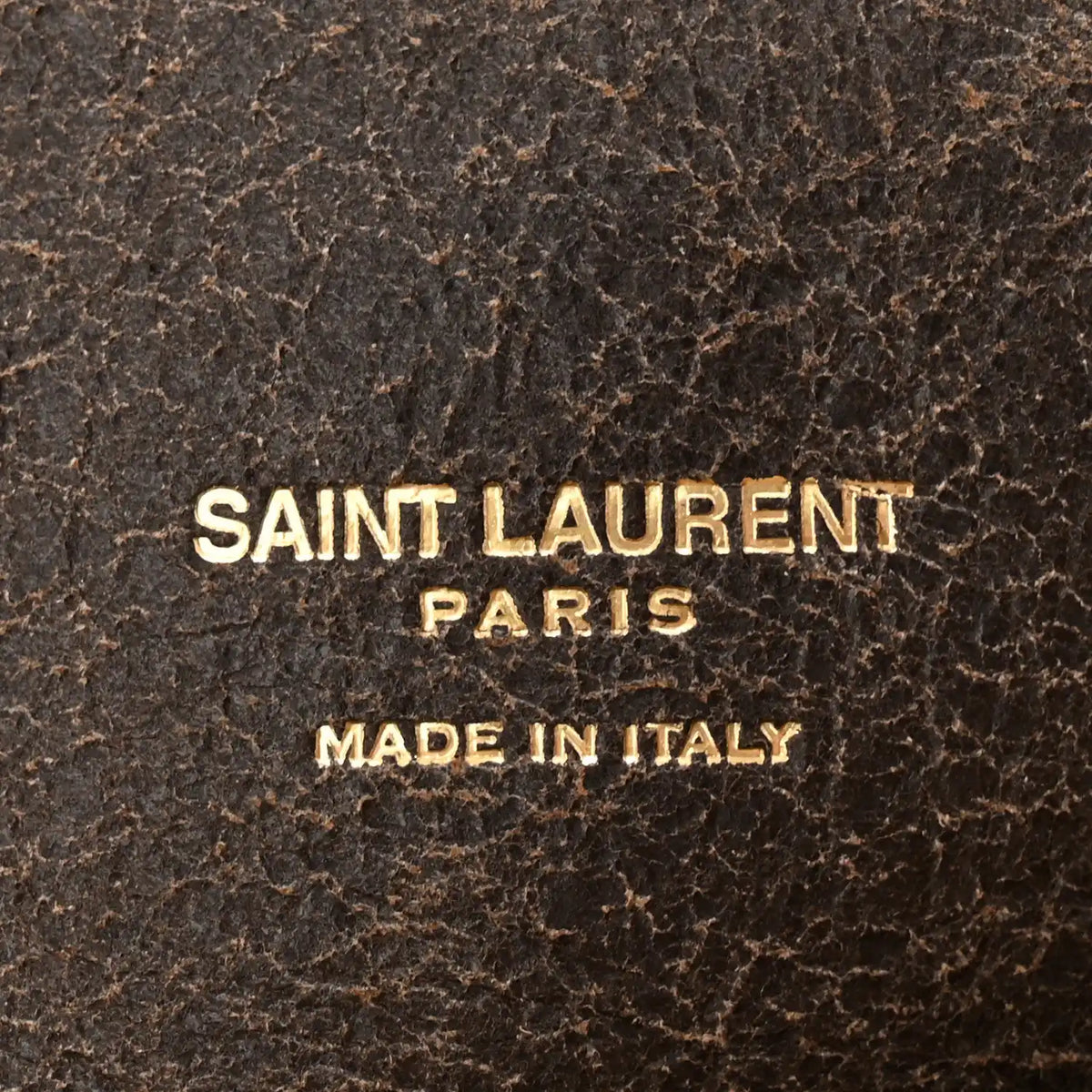 SAINT LAURENT PARIS Made in Italy gold text on dark brown leather