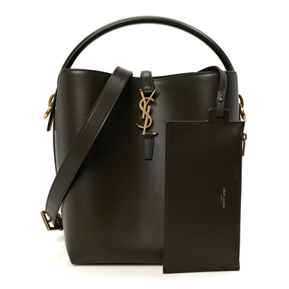 Shiny bucket bag with front pocket pouch, YSL charm, dark leather and gold hardware.
