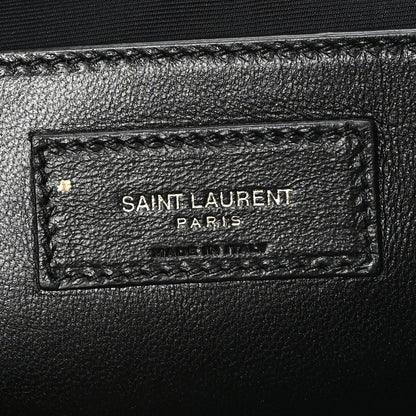 Leather brand tag inside shoulder bag reading SAINT LAURENT PARIS