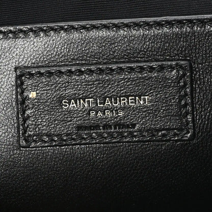 Leather brand tag inside shoulder bag reading SAINT LAURENT PARIS
