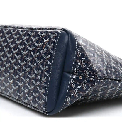 Navy tote bag bottom corner close-up with logo canvas and leather trim