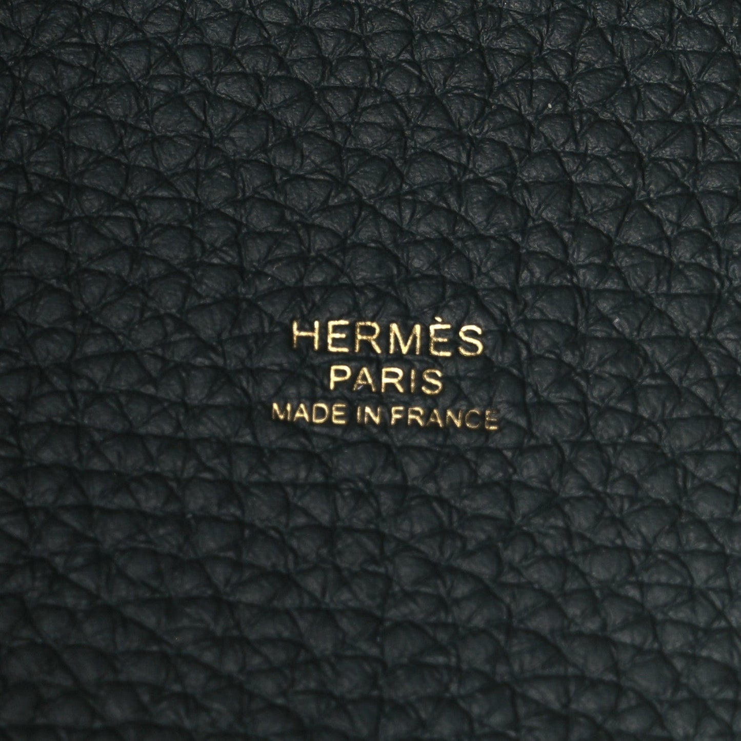 Black textured leather panel with embossed HERMES PARIS and MADE IN FRANCE