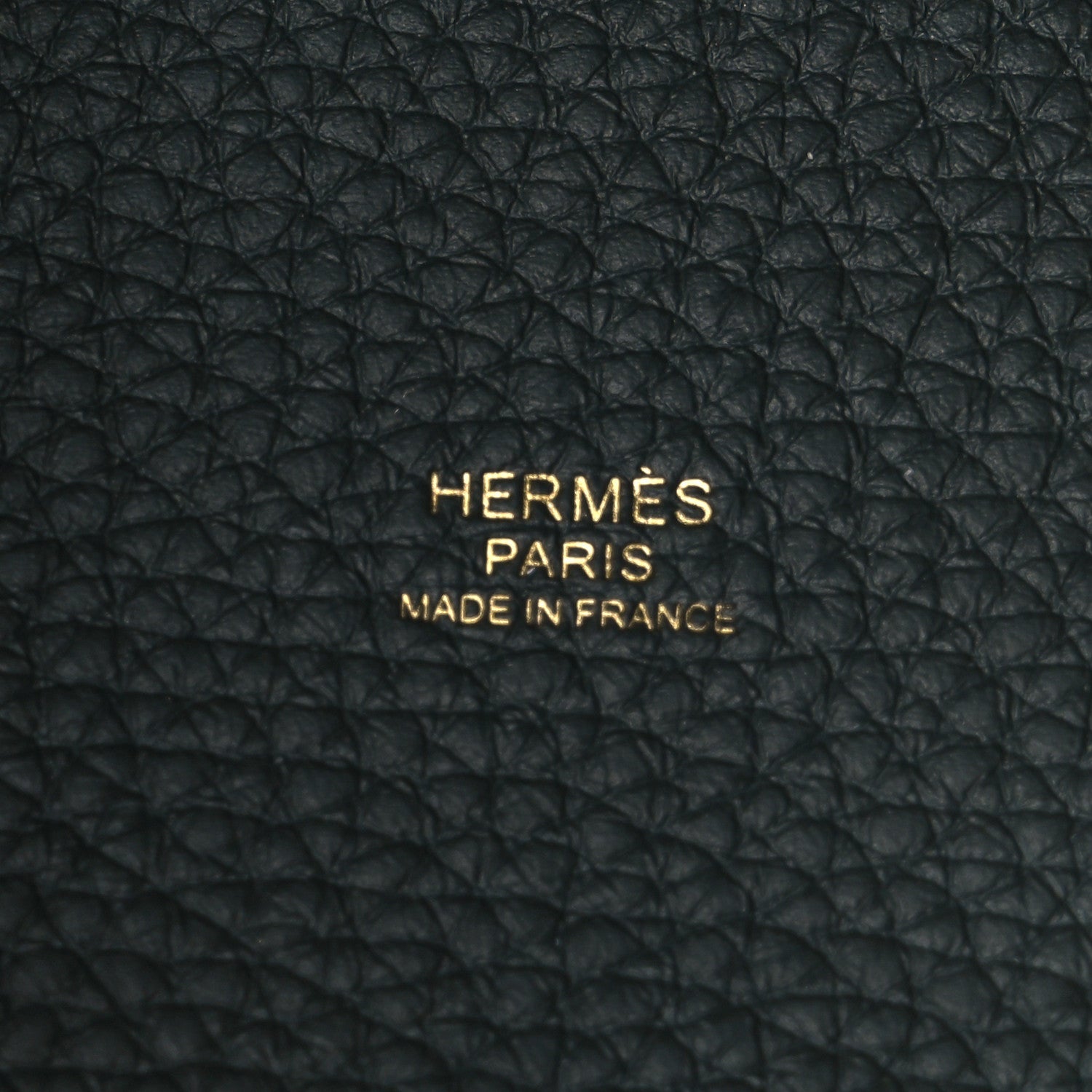 Black textured leather panel with embossed HERMES PARIS and MADE IN FRANCE