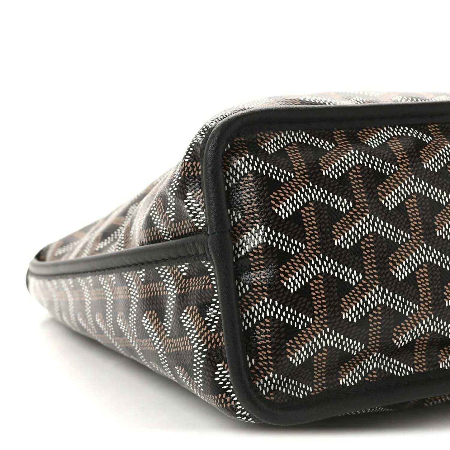 Reversible mini pouch bag close-up of patterned canvas with black zip trim