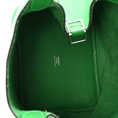 Green leather tote interior with label and front lock hardware
