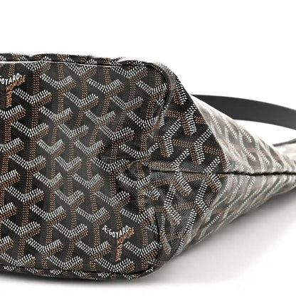Goyard hobo bag side close-up with repeating monogram pattern and black leather trim