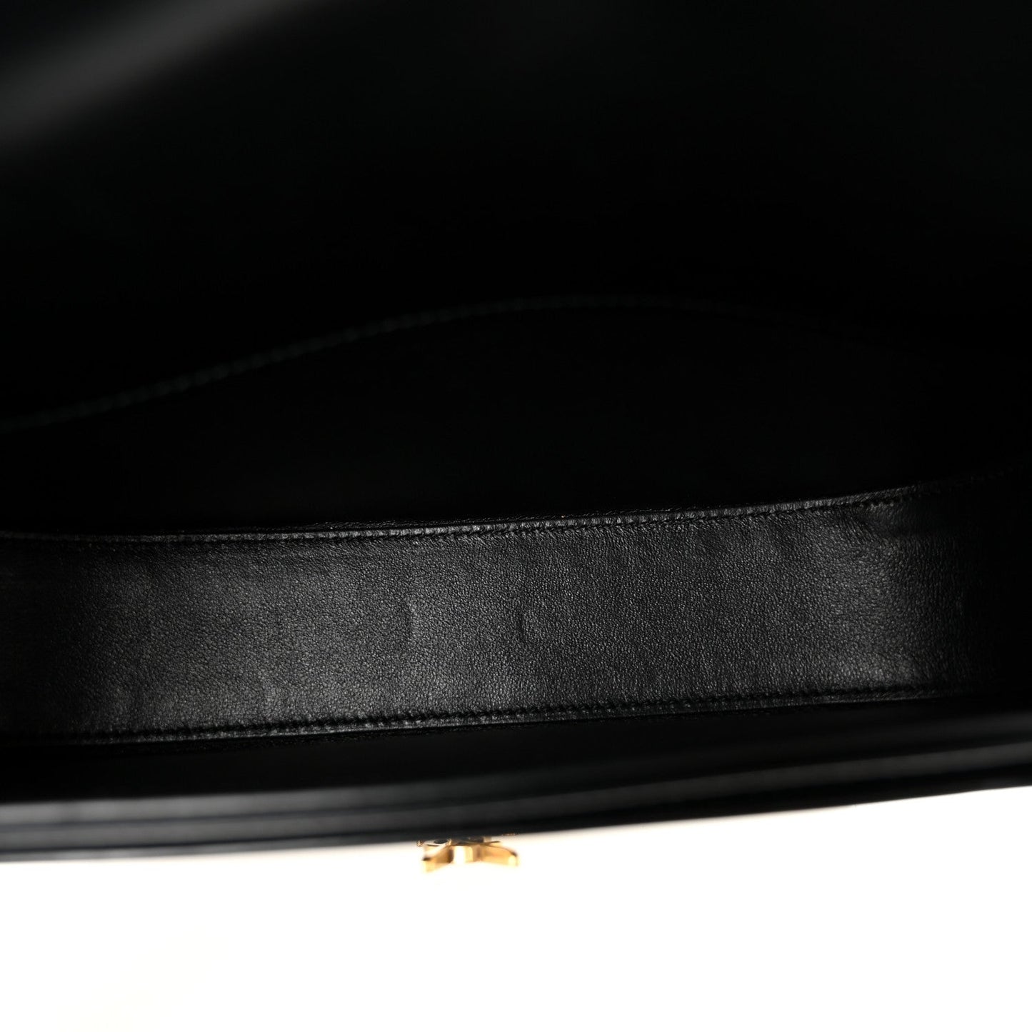 Black leather crossbody bag interior lining with neat stitching and inner trim edge.