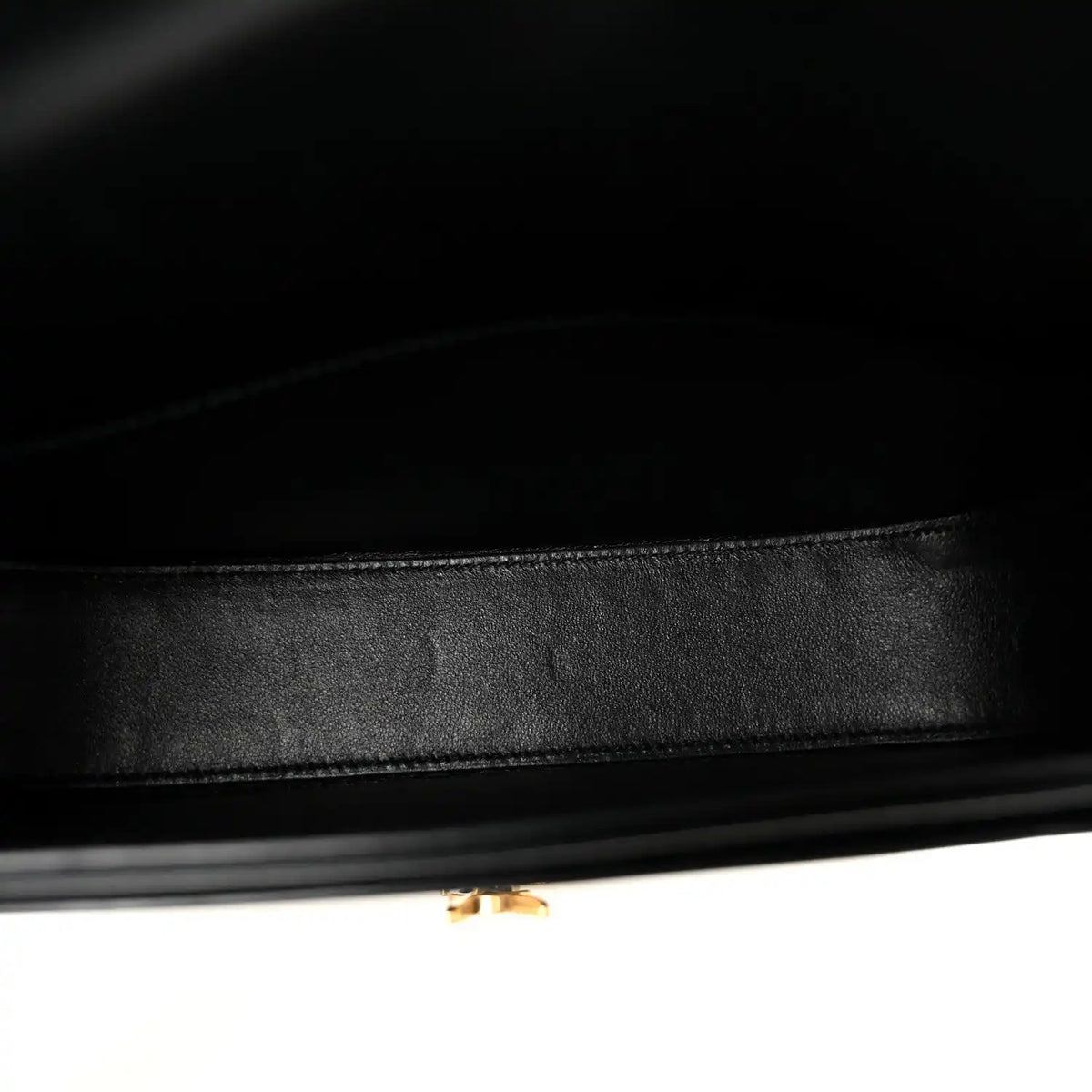 Black leather crossbody bag interior lining with neat stitching and inner trim edge.