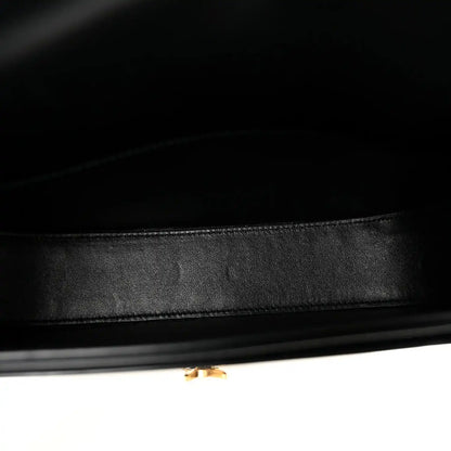 Black leather crossbody bag interior lining with neat stitching and inner trim edge.