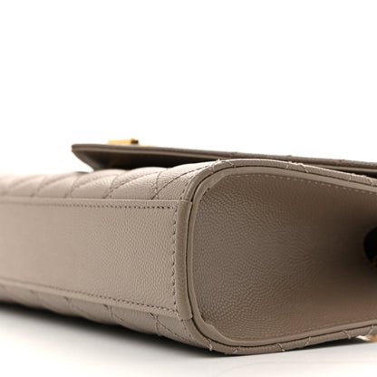 Textured satchel side panel with rounded edge and stitching
