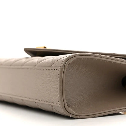 Textured satchel side panel with rounded edge and stitching