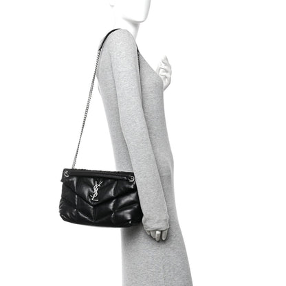Black quilted puffer small satchel on shoulder, chain strap and front YSL logo hardware.