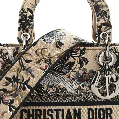 Floral embroidered canvas bag top handle with Dior charm and logo band detail.