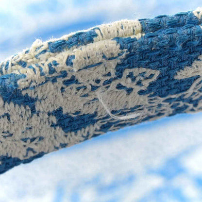 Blue and cream toile embroidery pattern on tote bag side, detailed close-up