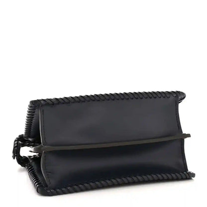 Midnight blue leather petite satchel with flap top and braided edge detail