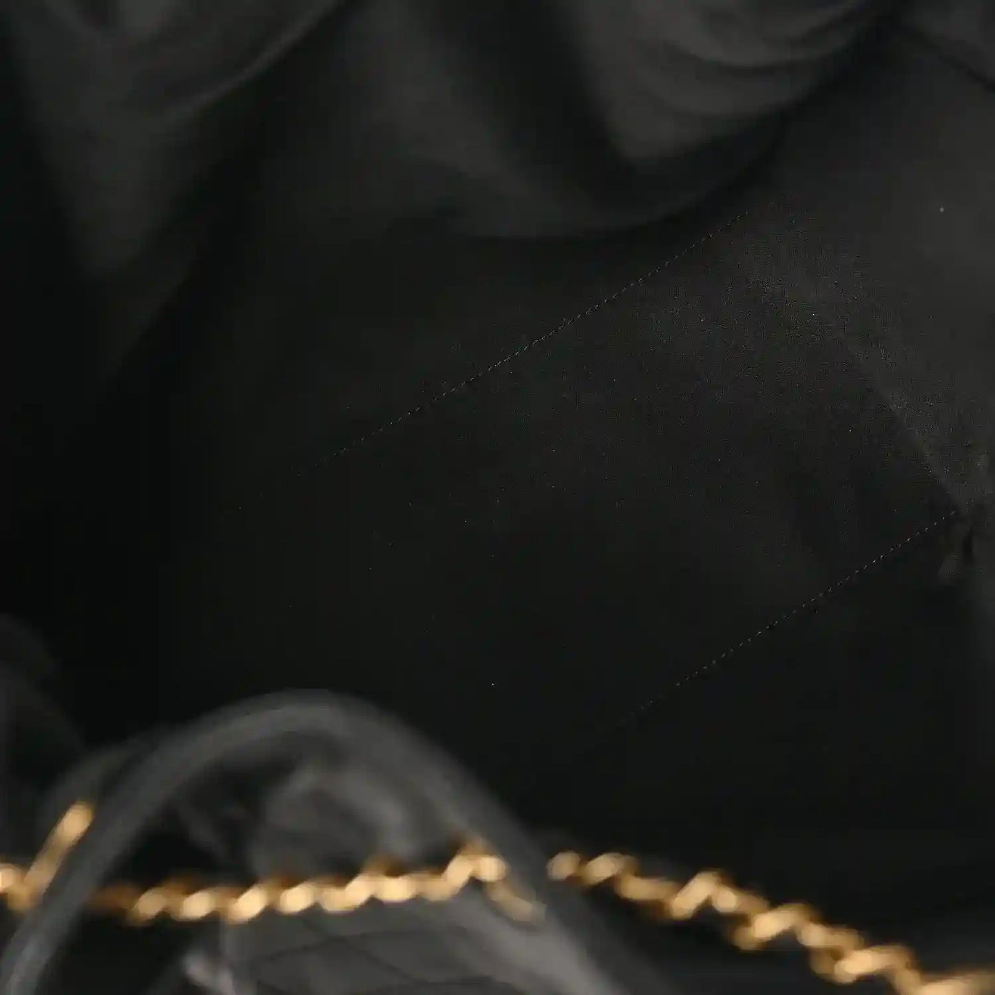 Black quilted leather handbag seam and diamond stitching detail