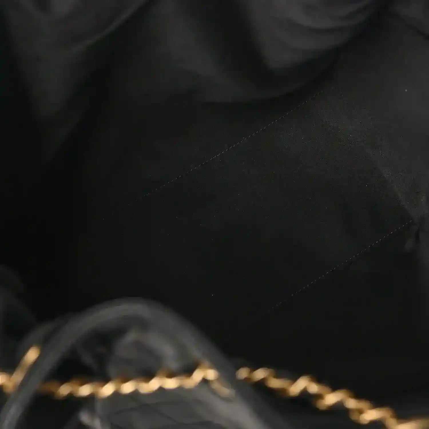 Black quilted leather handbag seam and diamond stitching detail