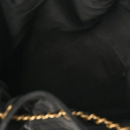 Black quilted leather handbag seam and diamond stitching detail