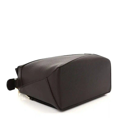 Dark chestnut grained leather small bag showing structured sides and corner seam detailing