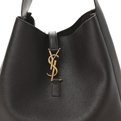 Top closure with gold YSL logo charm on dark leather hobo bag
