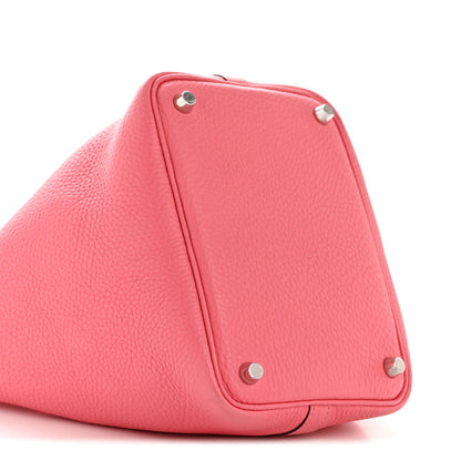Pink leather tote base with metal feet and triangular lock detail
