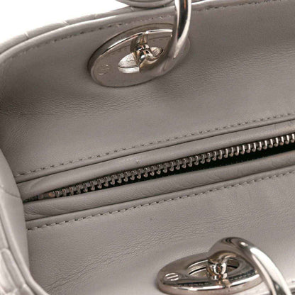 Grey leather handbag with interior zipper trim and silver hardware